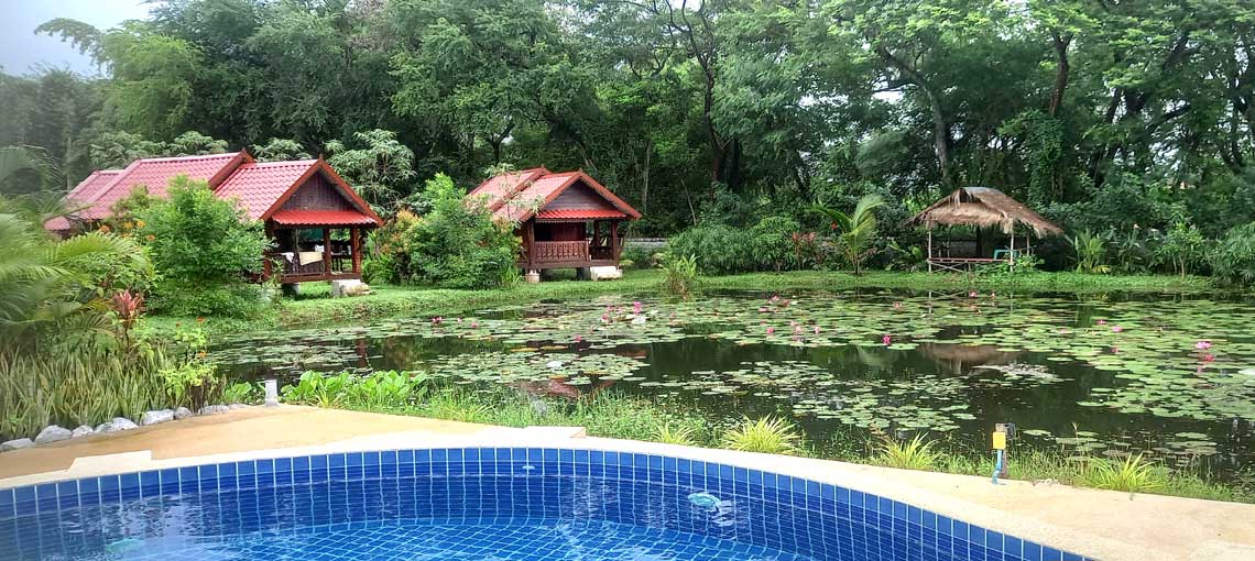 Enjoying a drink in Bua Daeng Cafe's huts around the lake